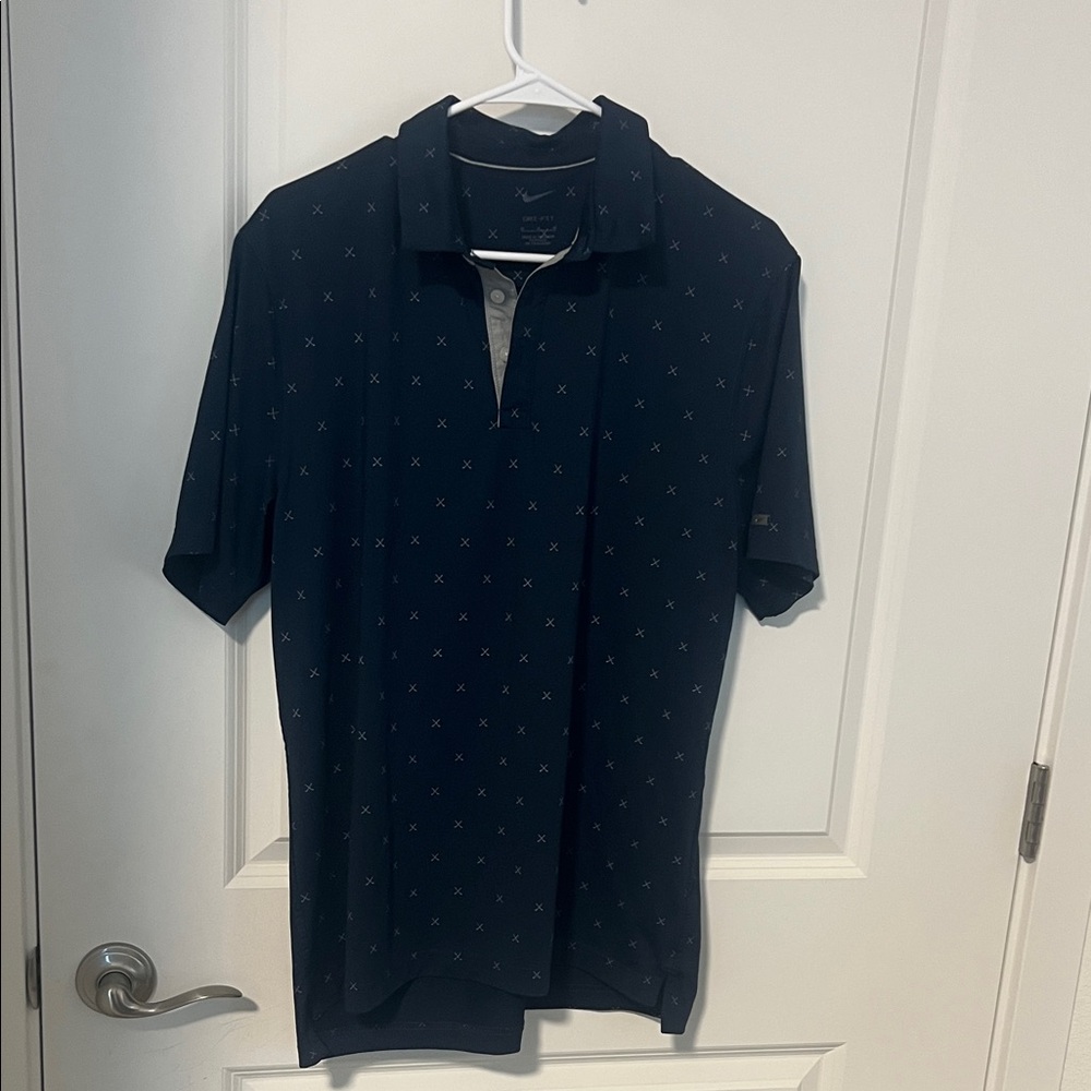 Nike Men's Navy Polo Shirt with Subtle Pattern